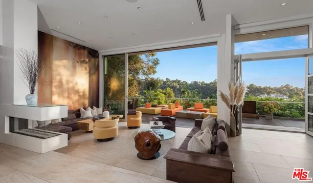 a very nice looking living room with a large window and a couch