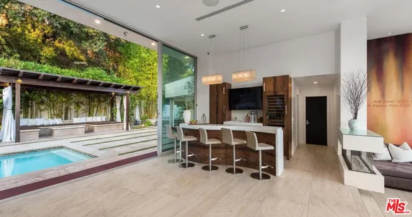 a view of living room with furniture and large window