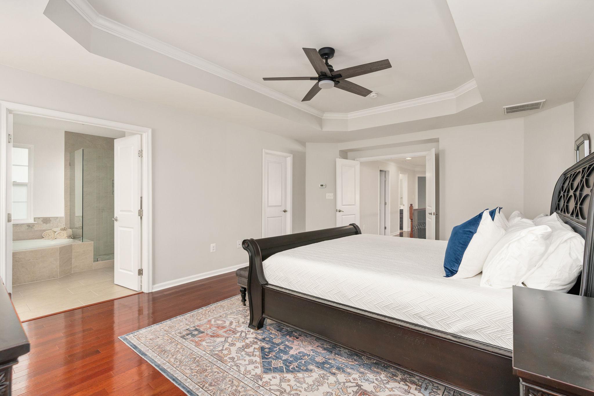 9417 Reservoir Road Fredericksburg, VA 22407 - Photo 61 of 76 a bedroom with a bed and wooden floor