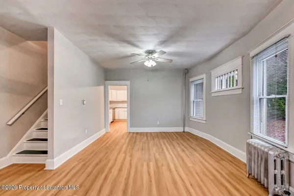 a view of a kitchen from the hallway