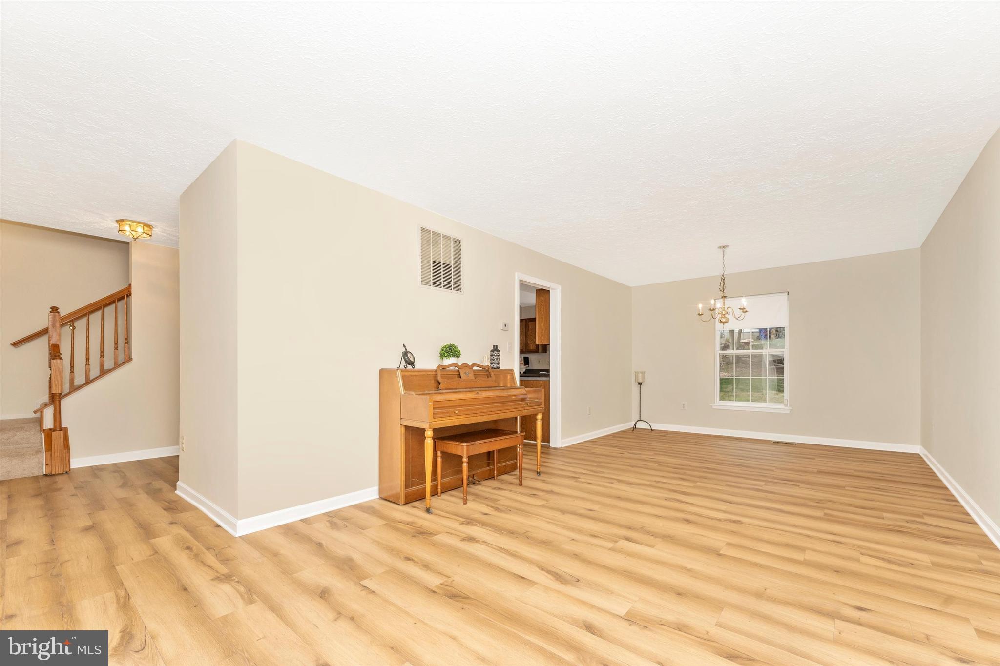1706 Algonquin Road Frederick, MD 21701 - Photo 8 of 62 a view of a livingroom with wooden floor and furniture