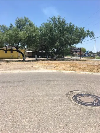 a view of a swimming pool and a yard