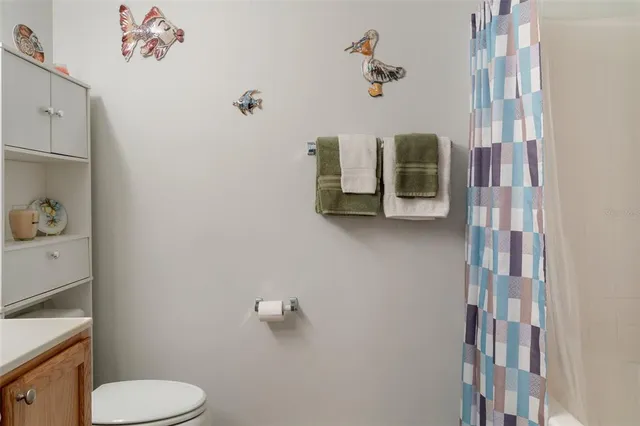 a bathroom with a toilet and a sink