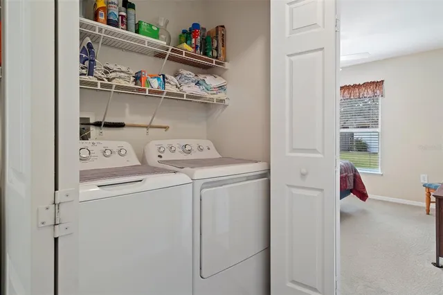 a utility room with dryer and washer