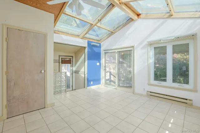 a view of an empty room with glass door