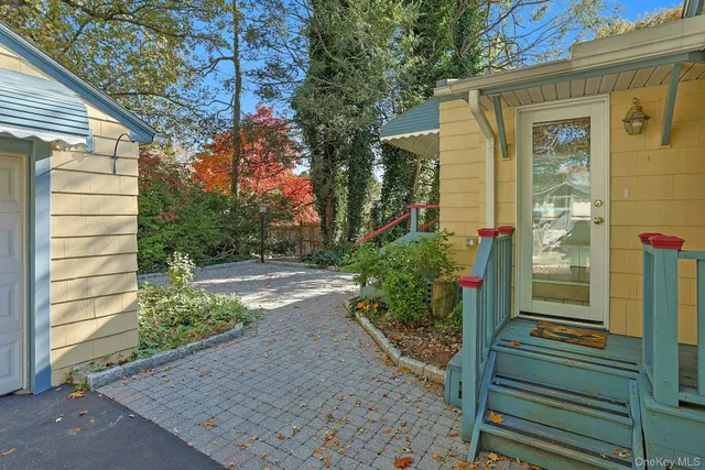 a front view of house with yard and green space