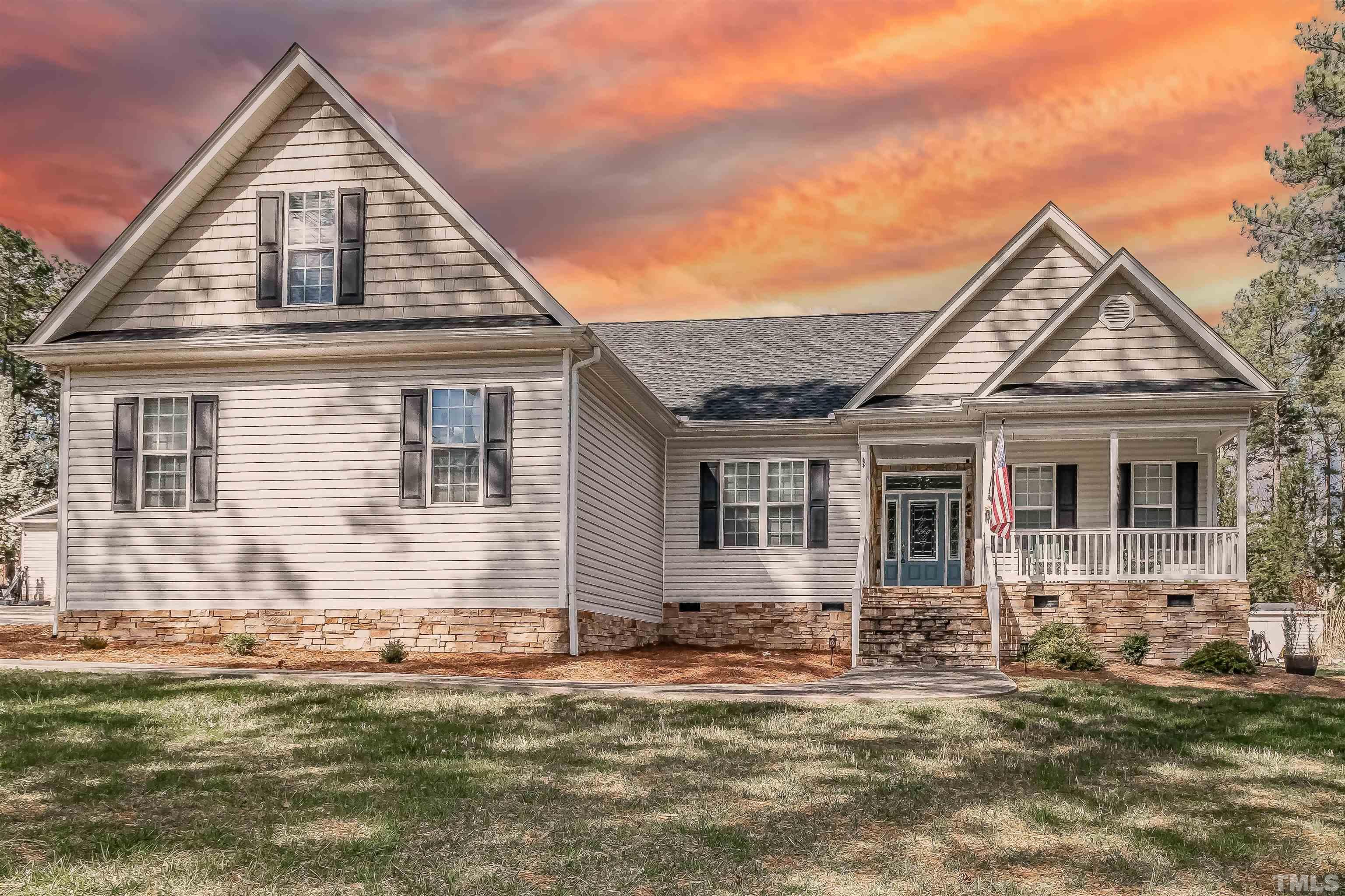1197 Trotters Ridge Road Stem, NC 27581 - Photo 1 of 79 a front view of a house with a yard