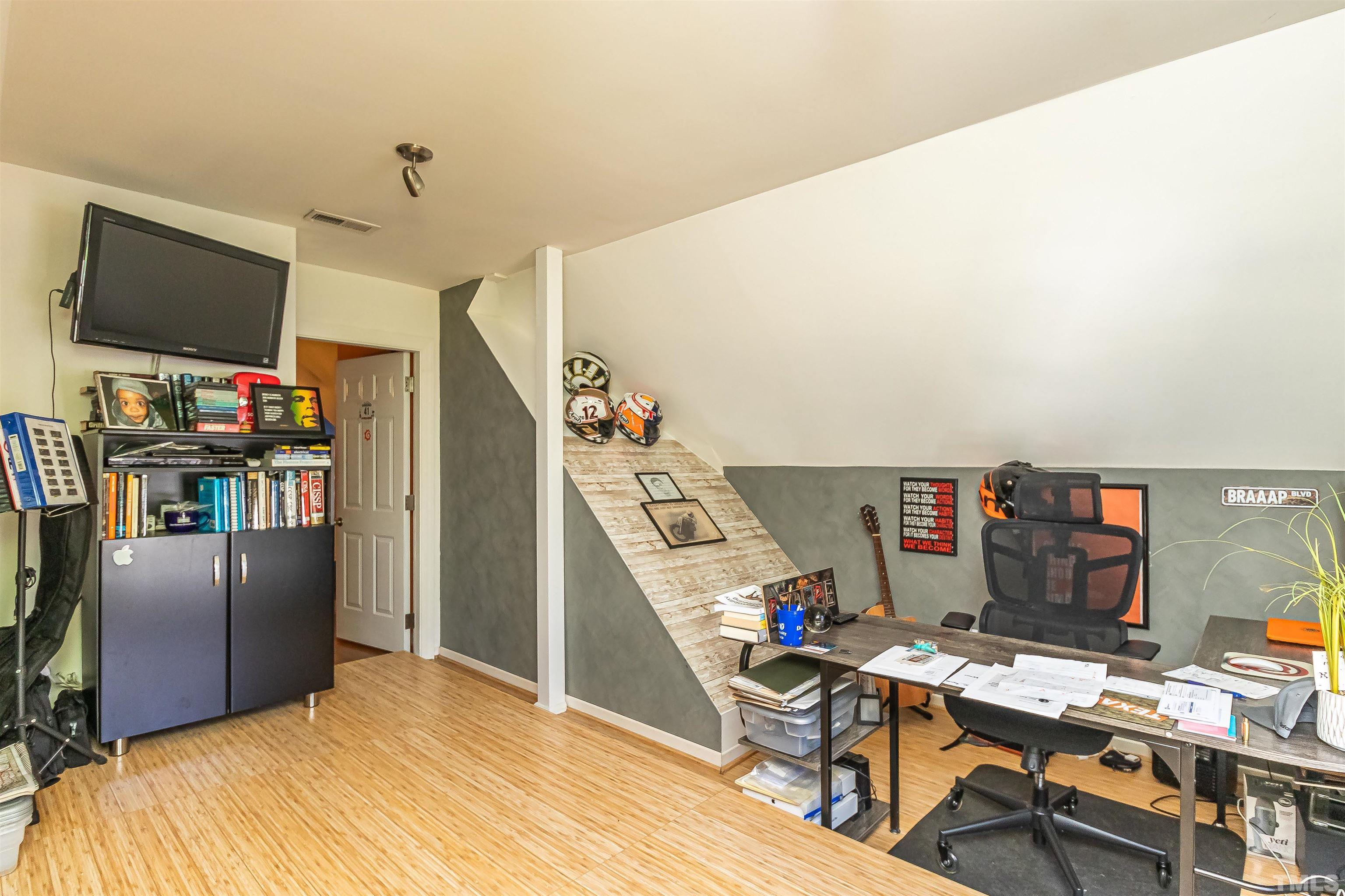 1197 Trotters Ridge Road Stem, NC 27581 - Photo 34 of 79 a room with furniture and a flat screen tv