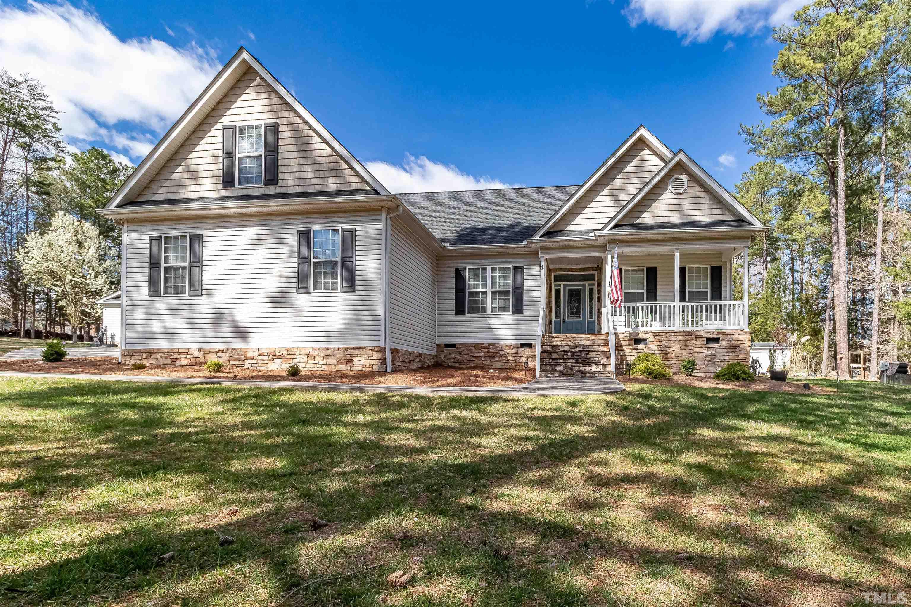 1197 Trotters Ridge Road Stem, NC 27581 - Photo 48 of 79 a front view of a house with a yard table and chairs