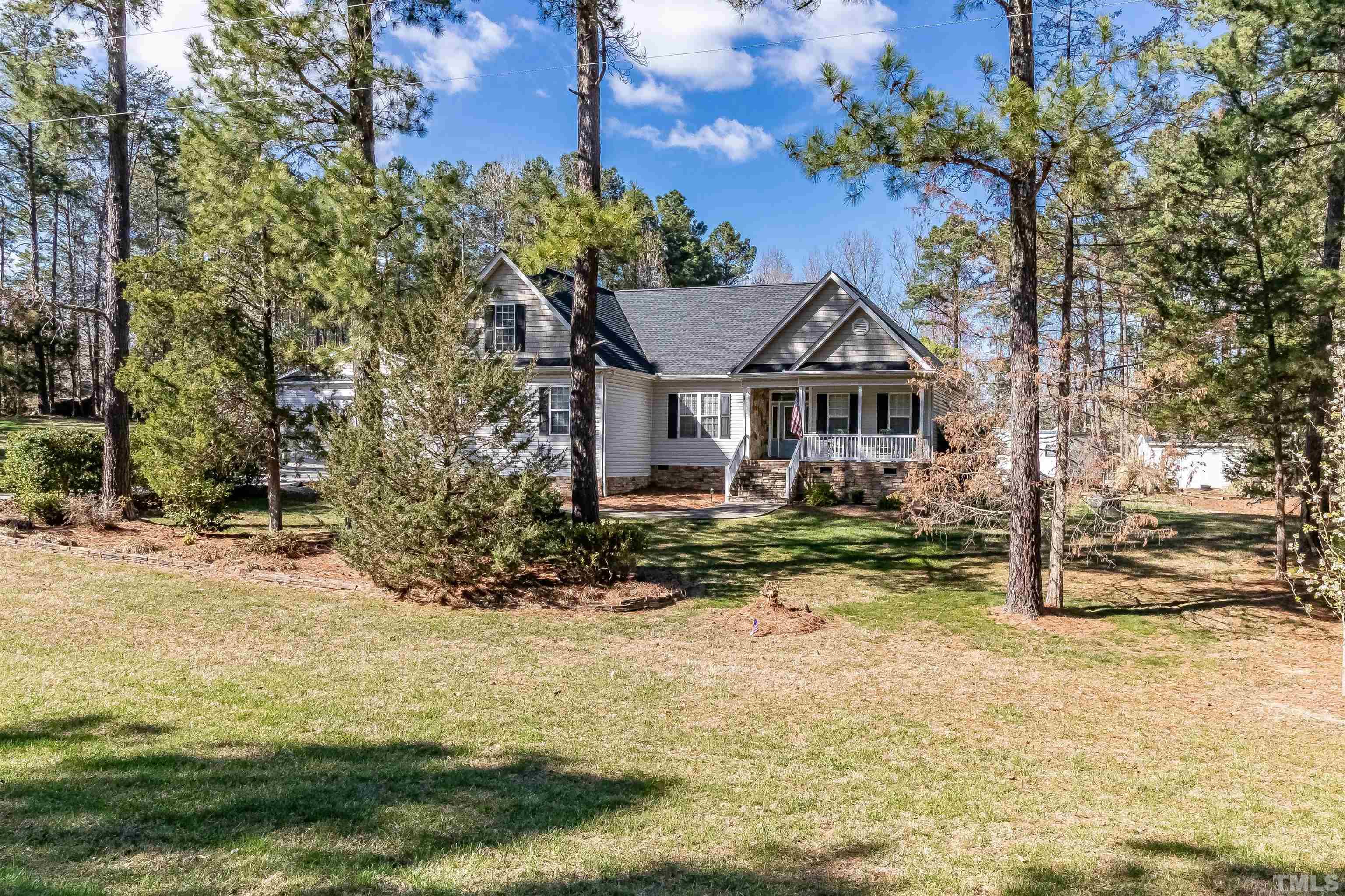 1197 Trotters Ridge Road Stem, NC 27581 - Photo 55 of 79 a front view of a house with a garden