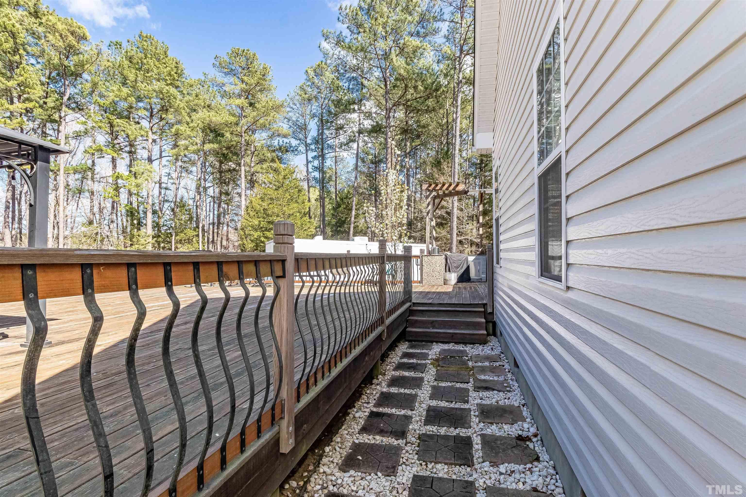 1197 Trotters Ridge Road Stem, NC 27581 - Photo 57 of 79 a view of a balcony with wooden floor and fence