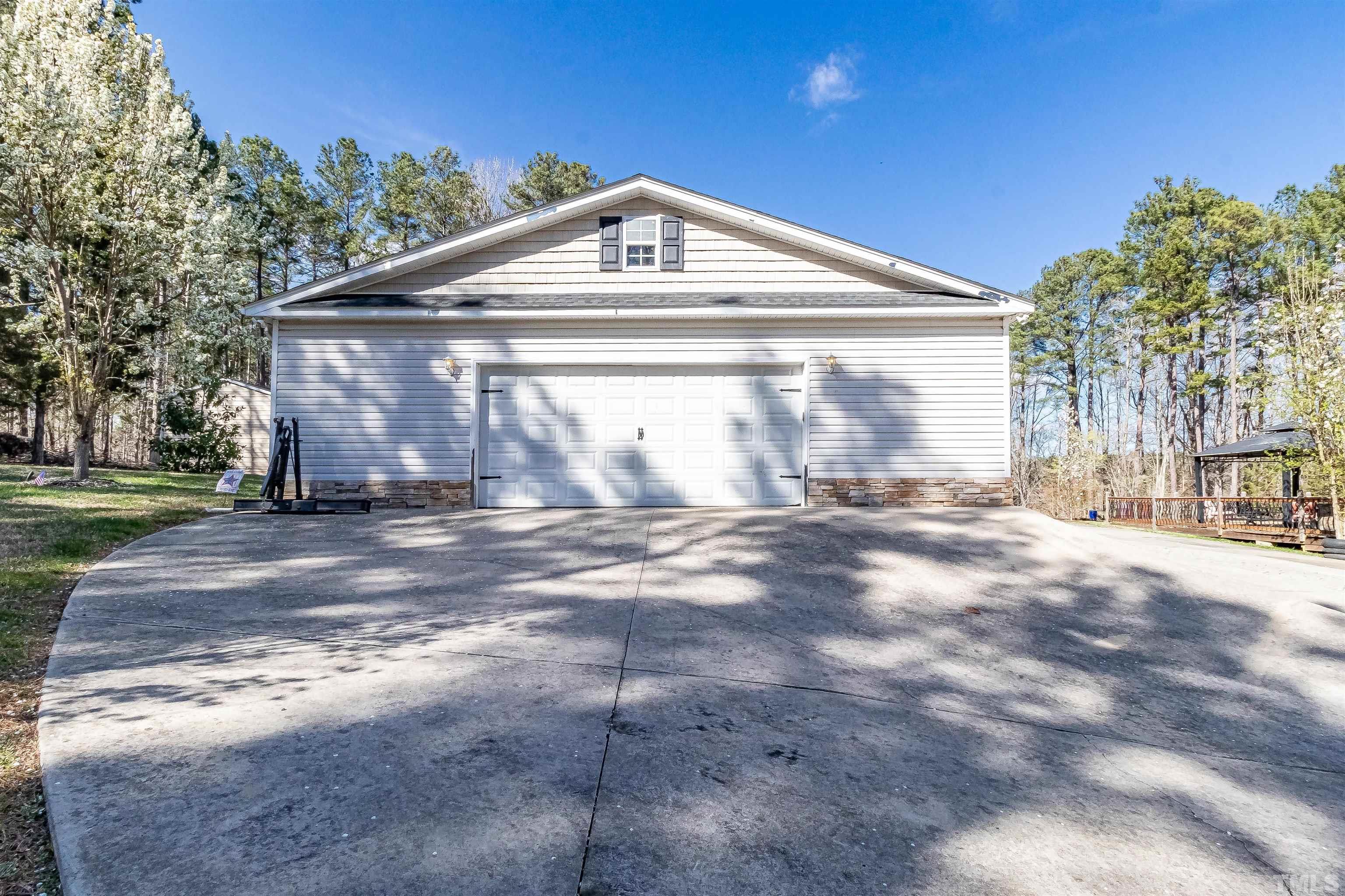 1197 Trotters Ridge Road Stem, NC 27581 - Photo 64 of 79 a front view of a house with a yard