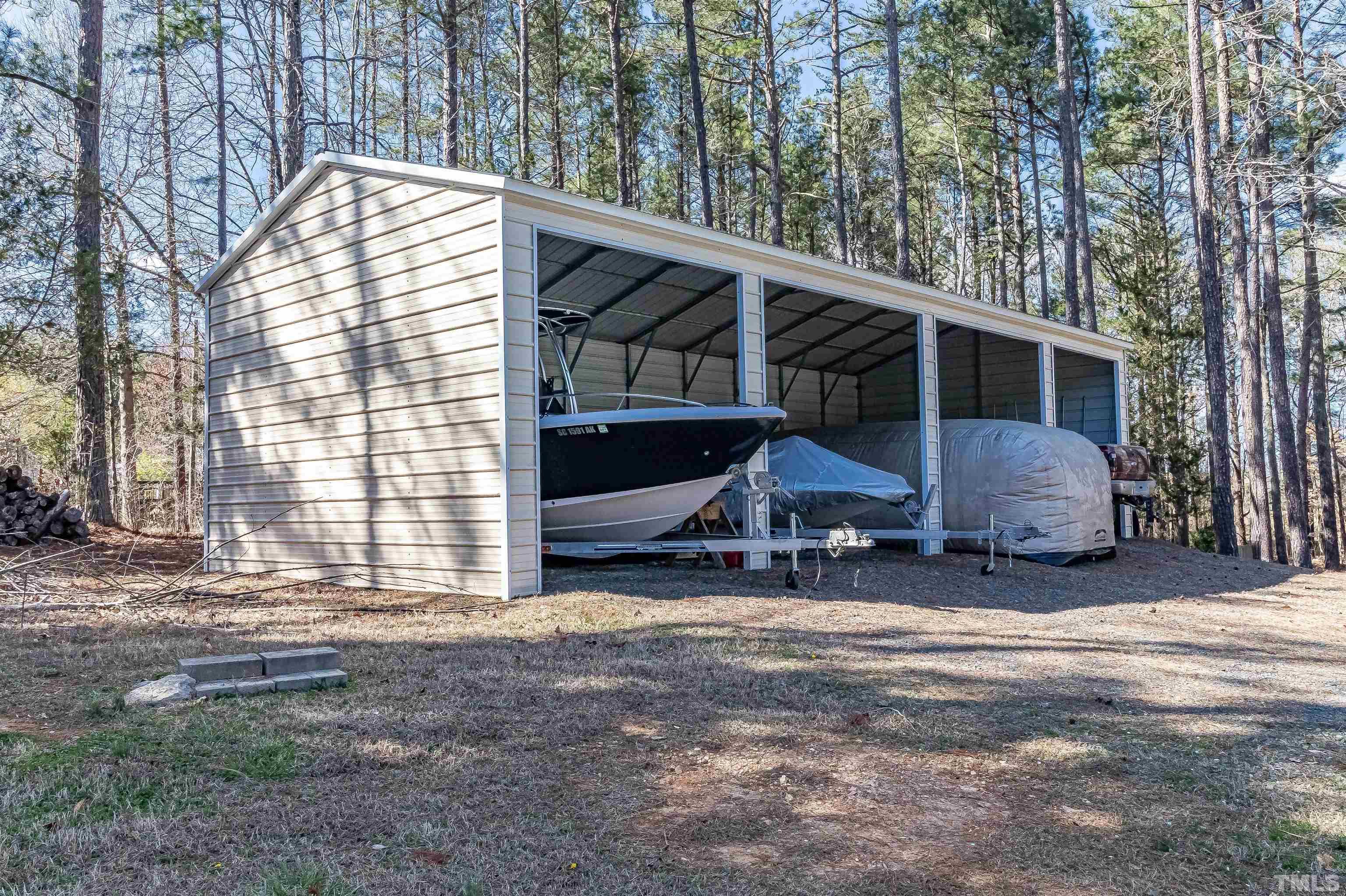 1197 Trotters Ridge Road Stem, NC 27581 - Photo 78 of 79 a view of a house with a yard and sitting area