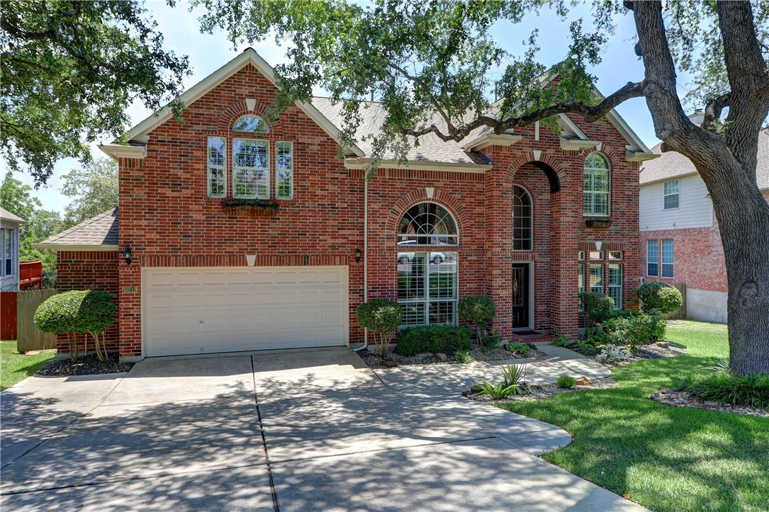 10212 Chestnut Ridge Road Austin, TX 78726 - Photo 1 of 1 a front view of a house with garden