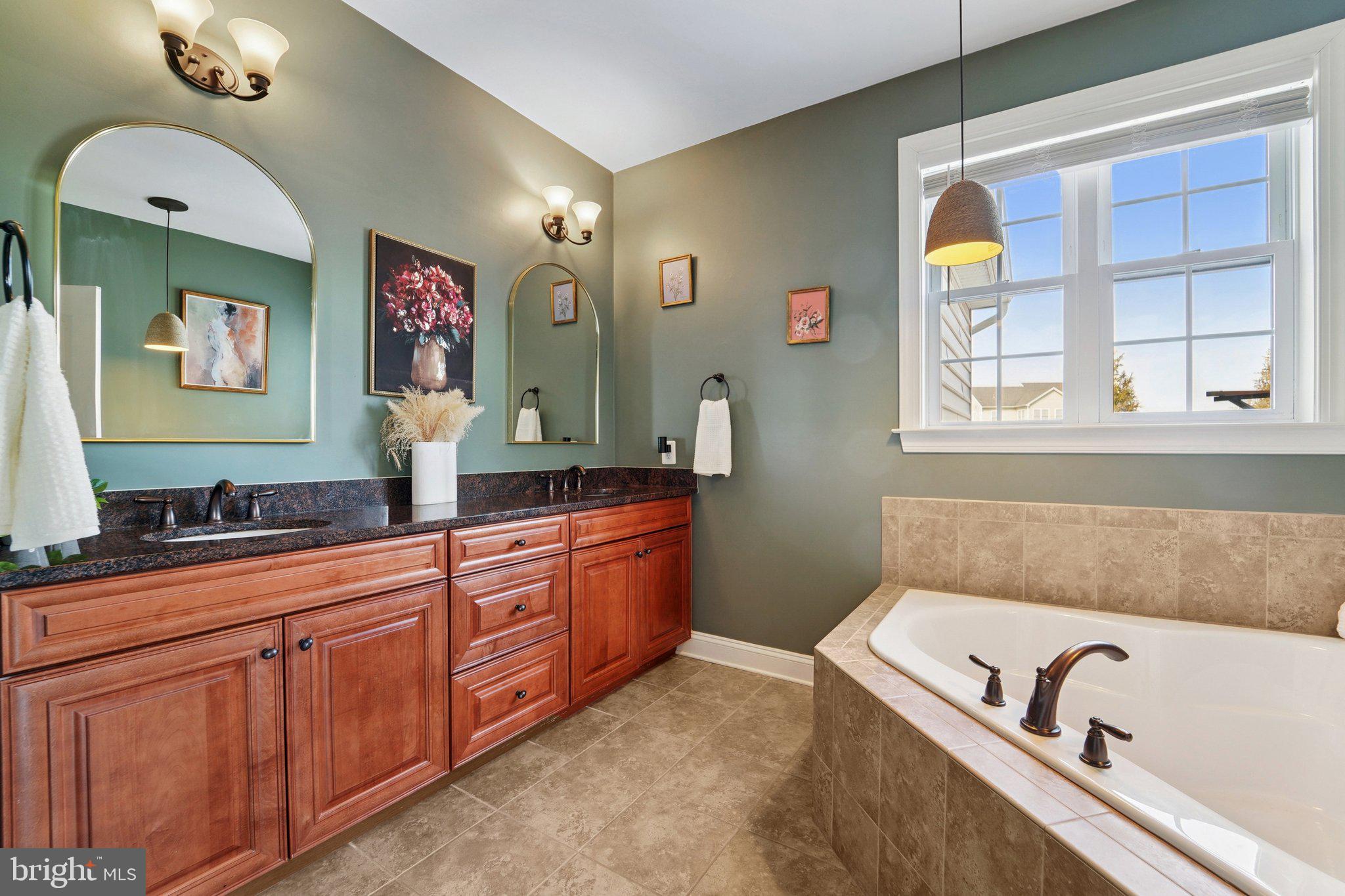 420 Irish Rebel Road Westminster, MD 21157 - Photo 27 of 71 a bathroom with a tub sink and mirror