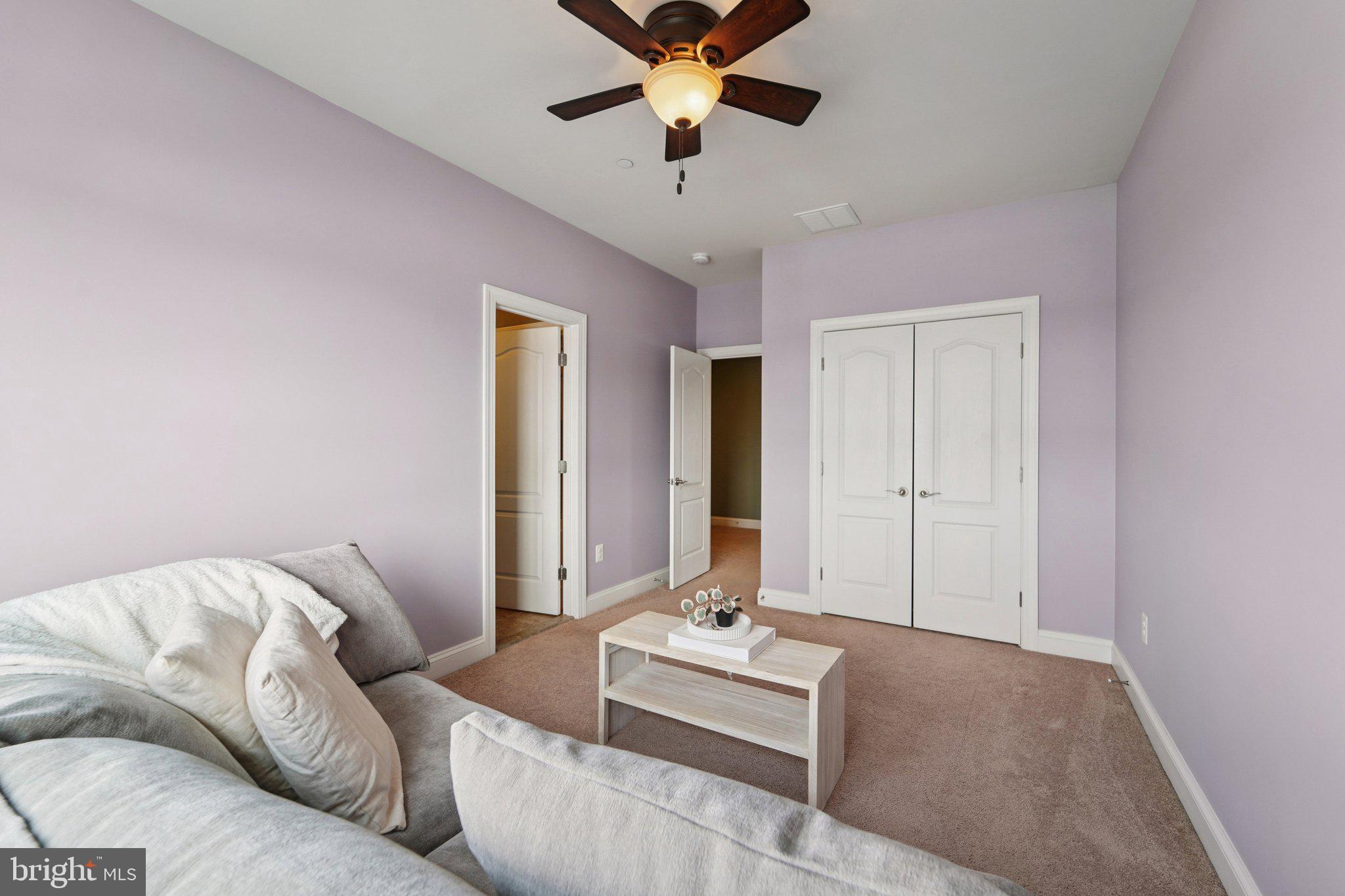 420 Irish Rebel Road Westminster, MD 21157 - Photo 31 of 71 a living room with furniture and a chandelier