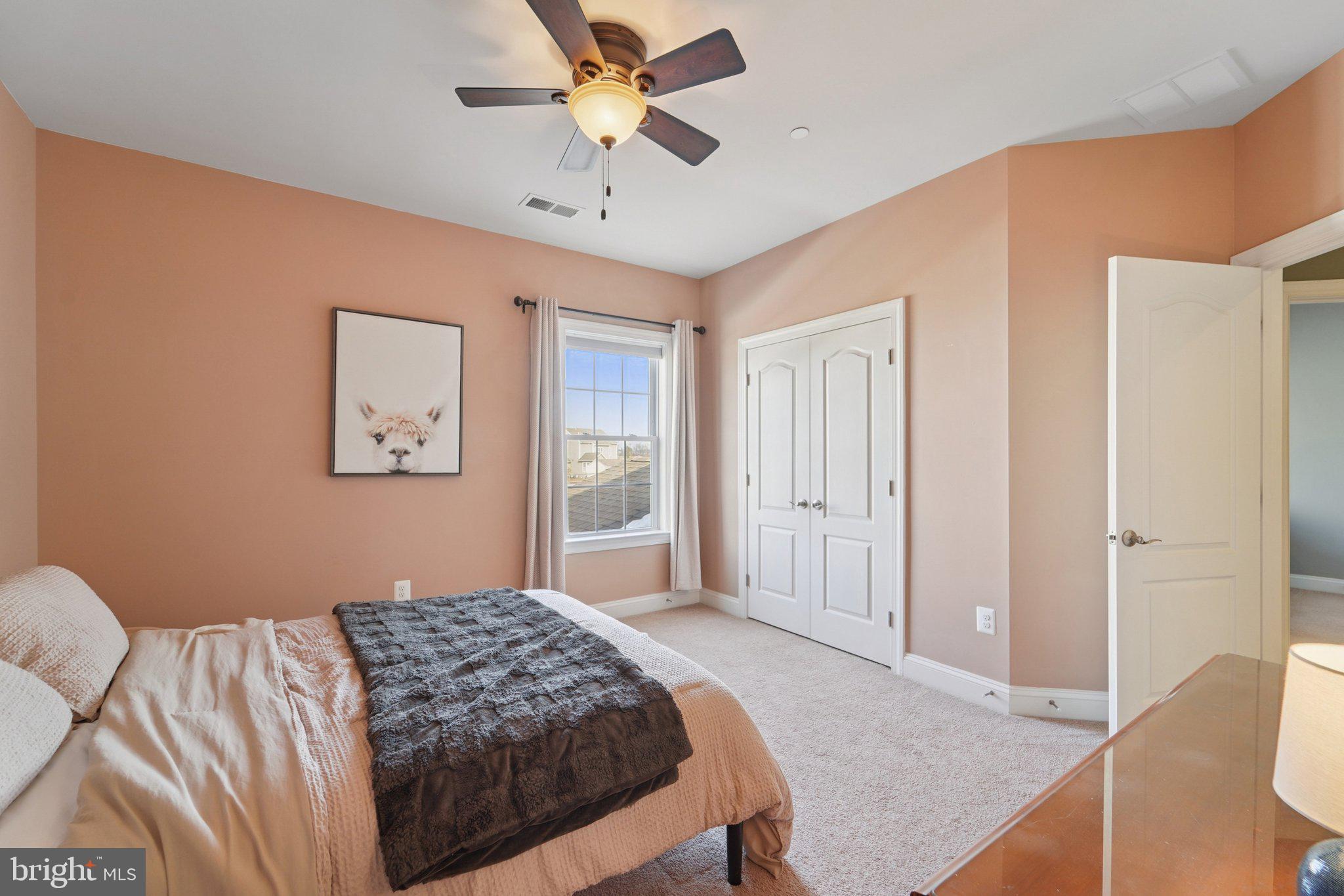 420 Irish Rebel Road Westminster, MD 21157 - Photo 34 of 71 a bedroom with a bed chandelier and a window
