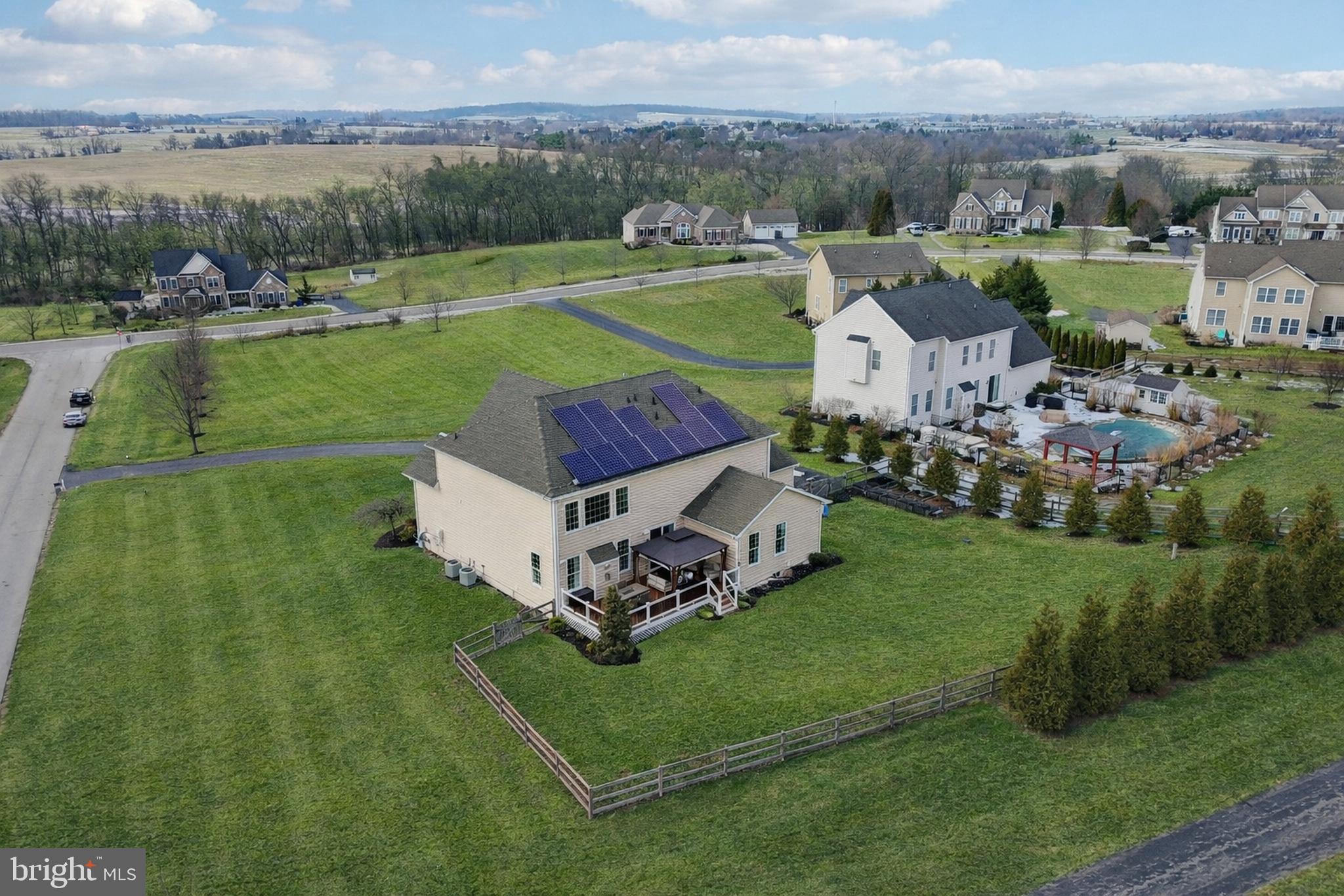 420 Irish Rebel Road Westminster, MD 21157 - Photo 4 of 71 an aerial view of a house with a garden and lake view