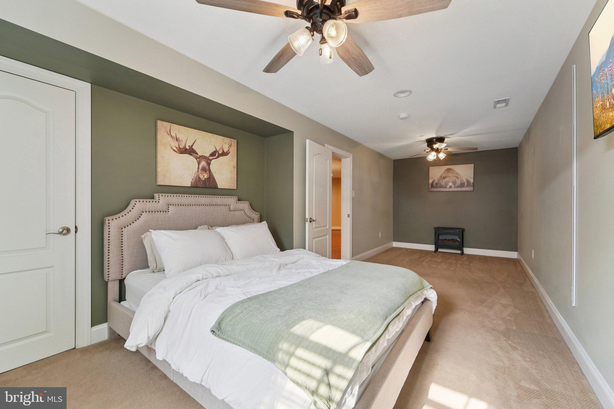 420 Irish Rebel Road Westminster, MD 21157 - Photo 49 of 71 a bedroom with a bed and a chandelier