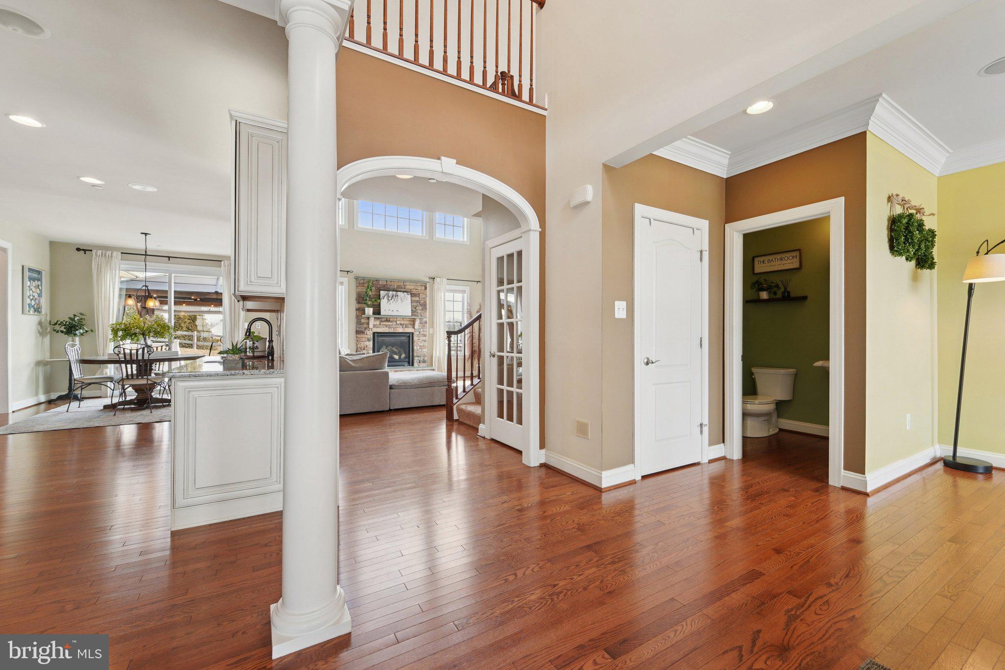 420 Irish Rebel Road Westminster, MD 21157 - Photo 9 of 71 a view of a living room kitchen with furniture and wooden floor