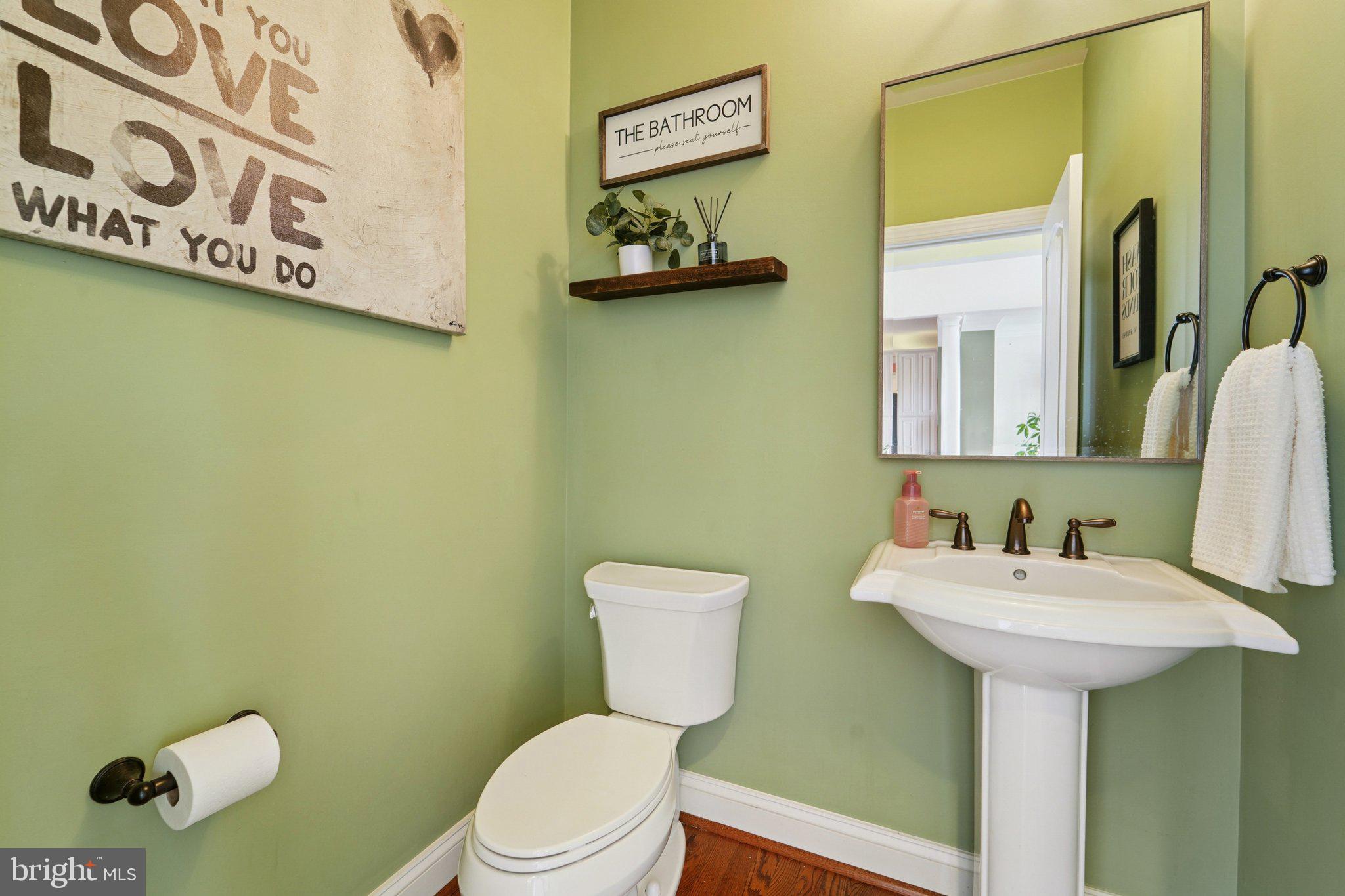 420 Irish Rebel Road Westminster, MD 21157 - Photo 10 of 71 a bathroom with a toilet sink and mirror