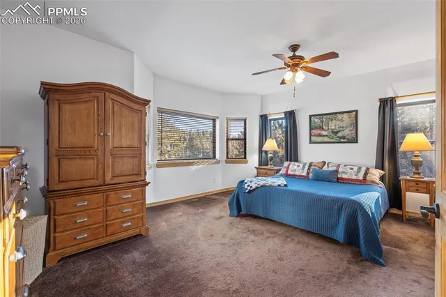 a bedroom with furniture and a chandelier