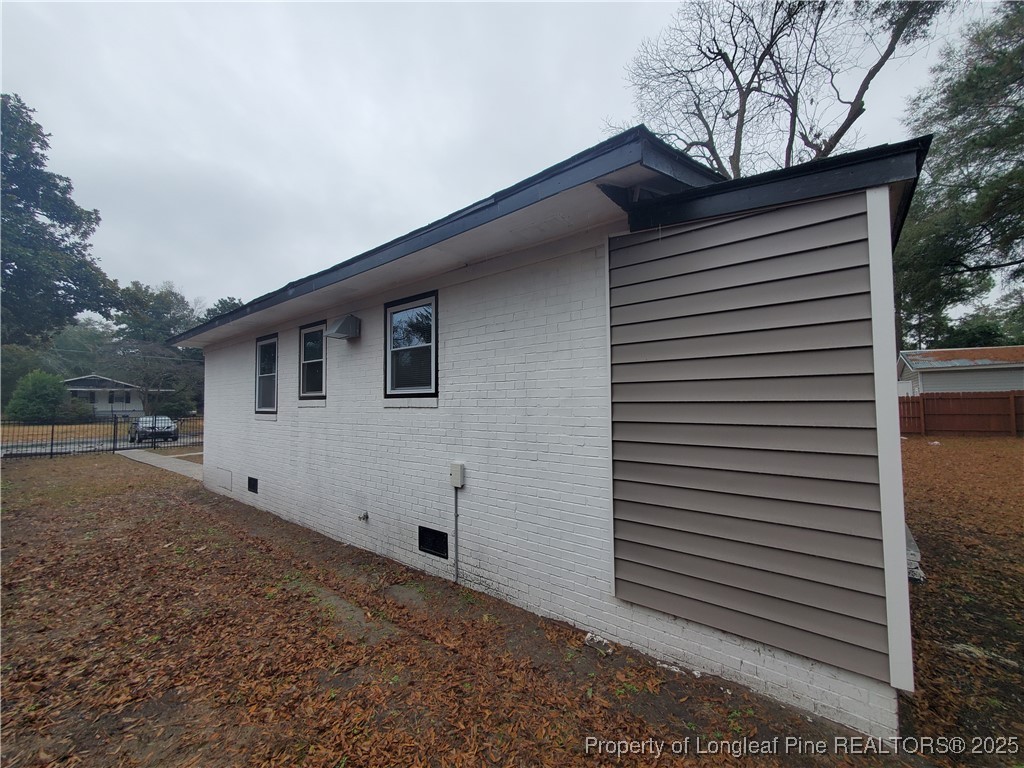 Undisclosed Address Fayetteville, NC 28305 - Photo 2 of 15 a view of backyard of house