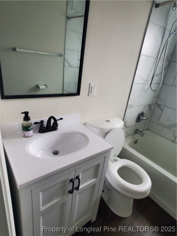 Undisclosed Address Fayetteville, NC 28305 - Photo 4 of 15 a bathroom with a sink a toilet and a mirror