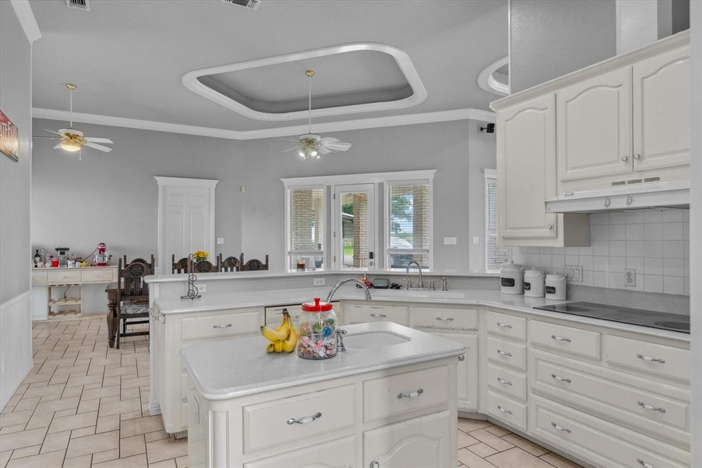 7182 Fm 2451 Road Scurry, TX 75158 - Photo 11 of 37 a kitchen with sink cabinets and stove