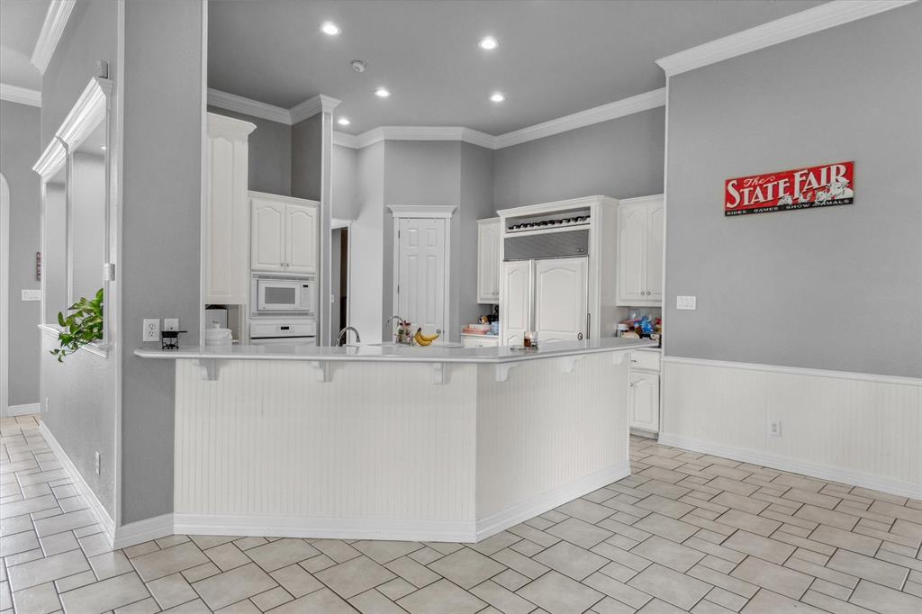 7182 Fm 2451 Road Scurry, TX 75158 - Photo 12 of 37 a large white kitchen with cabinets