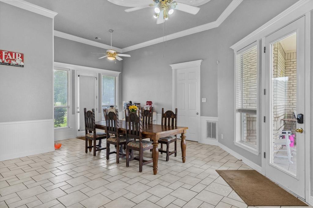 7182 Fm 2451 Road Scurry, TX 75158 - Photo 15 of 37 a view of a dining room with furniture and chandelier