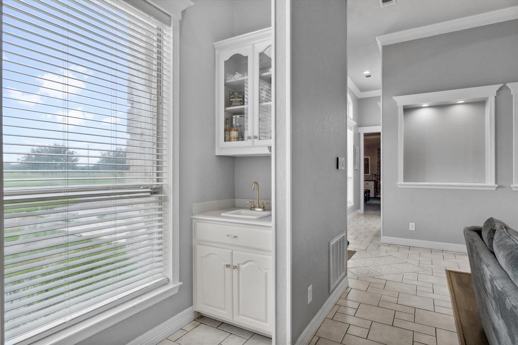 7182 Fm 2451 Road Scurry, TX 75158 - Photo 18 of 37 a bathroom with a sink and a mirror