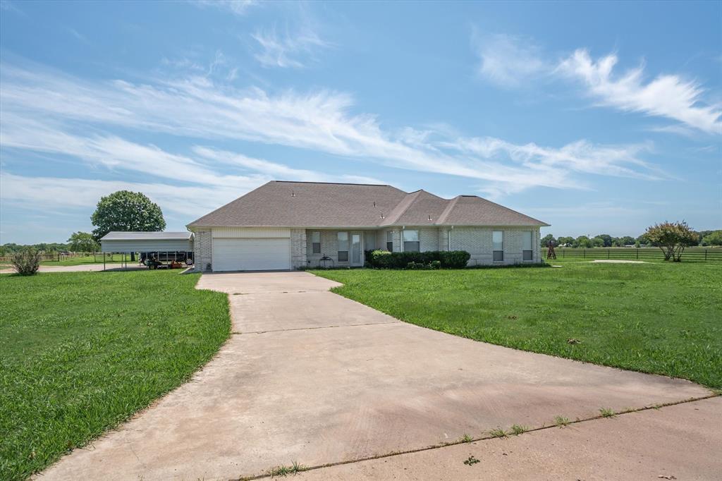 7182 Fm 2451 Road Scurry, TX 75158 - Photo 21 of 37 a front view of house with yard and green space