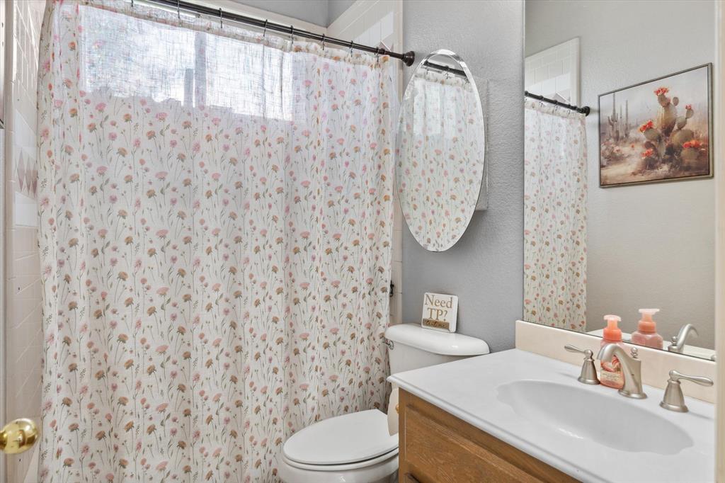 7182 Fm 2451 Road Scurry, TX 75158 - Photo 27 of 37 a bathroom with a sink toilet and shower