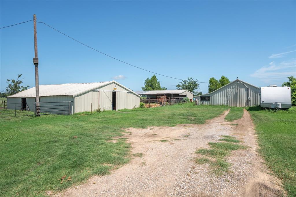 7182 Fm 2451 Road Scurry, TX 75158 - Photo 32 of 37 a house view with a garden space