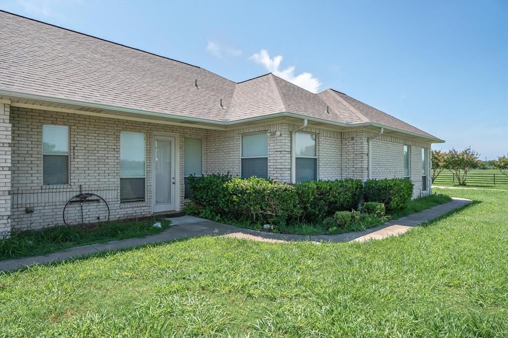 7182 Fm 2451 Road Scurry, TX 75158 - Photo 35 of 37 a front view of a house with a yard