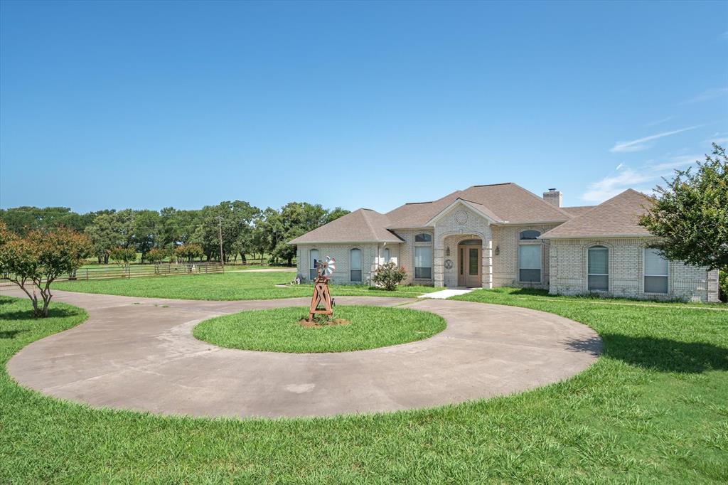 7182 Fm 2451 Road Scurry, TX 75158 - Photo 4 of 37 a front view of a house with a yard and green space