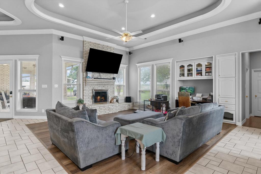 7182 Fm 2451 Road Scurry, TX 75158 - Photo 7 of 37 a living room with fireplace furniture and a flat screen tv
