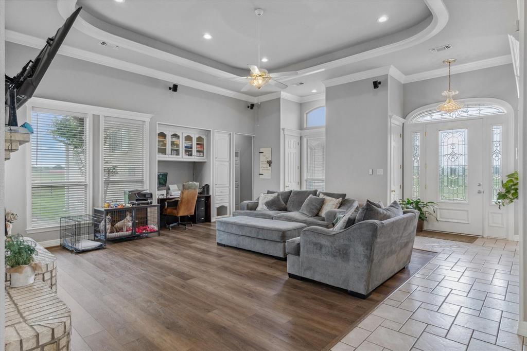 7182 Fm 2451 Road Scurry, TX 75158 - Photo 9 of 37 a living room with furniture and a fireplace