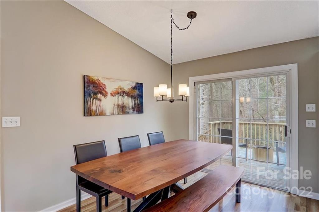 497 Fanning Bridge Road Fletcher, NC 28732 - Photo 17 of 41 a view of a dining room with furniture window and wooden floor