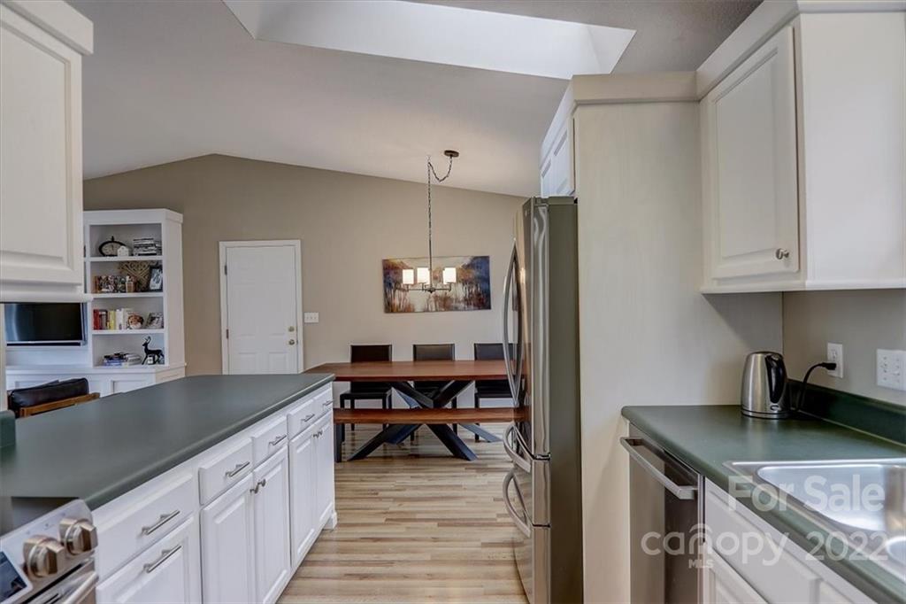 497 Fanning Bridge Road Fletcher, NC 28732 - Photo 25 of 41 a kitchen with granite countertop a sink and cabinets