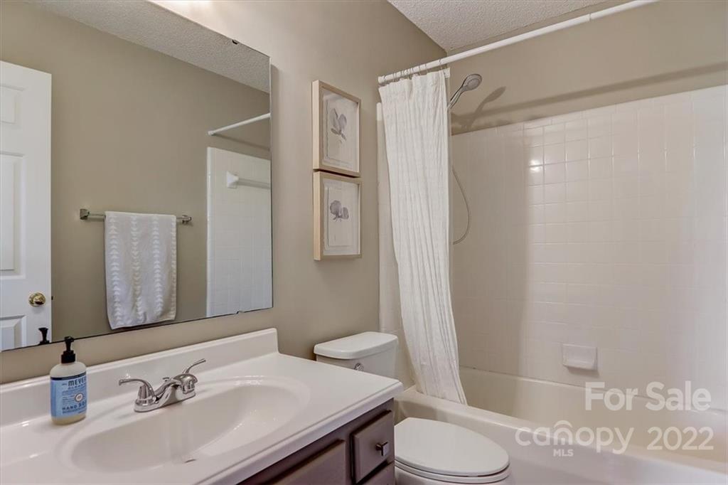 497 Fanning Bridge Road Fletcher, NC 28732 - Photo 27 of 41 a bathroom with a sink toilet and shower