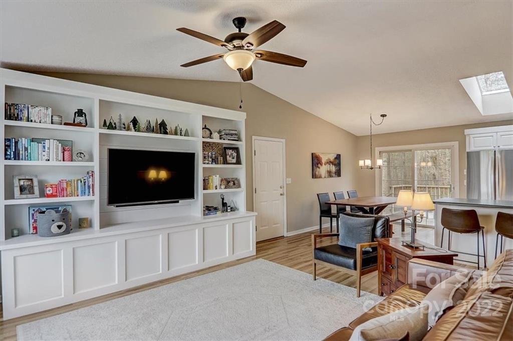 497 Fanning Bridge Road Fletcher, NC 28732 - Photo 7 of 41 a living room with furniture and a flat screen tv