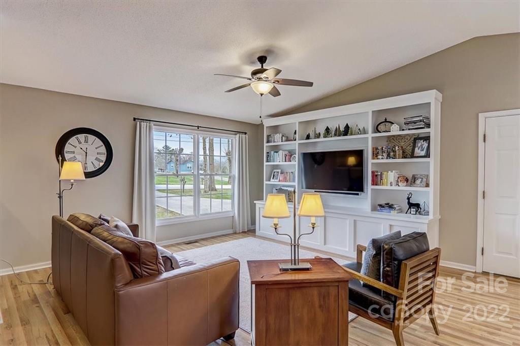 497 Fanning Bridge Road Fletcher, NC 28732 - Photo 10 of 41 a living room with furniture a flat screen tv and a window