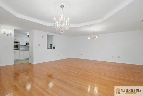 a view of a livingroom with a chandelier fan