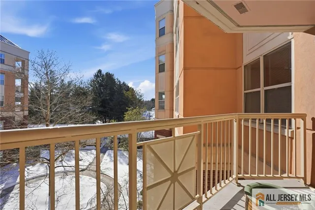 a view of a patio with couches and table and chairs and potted plants