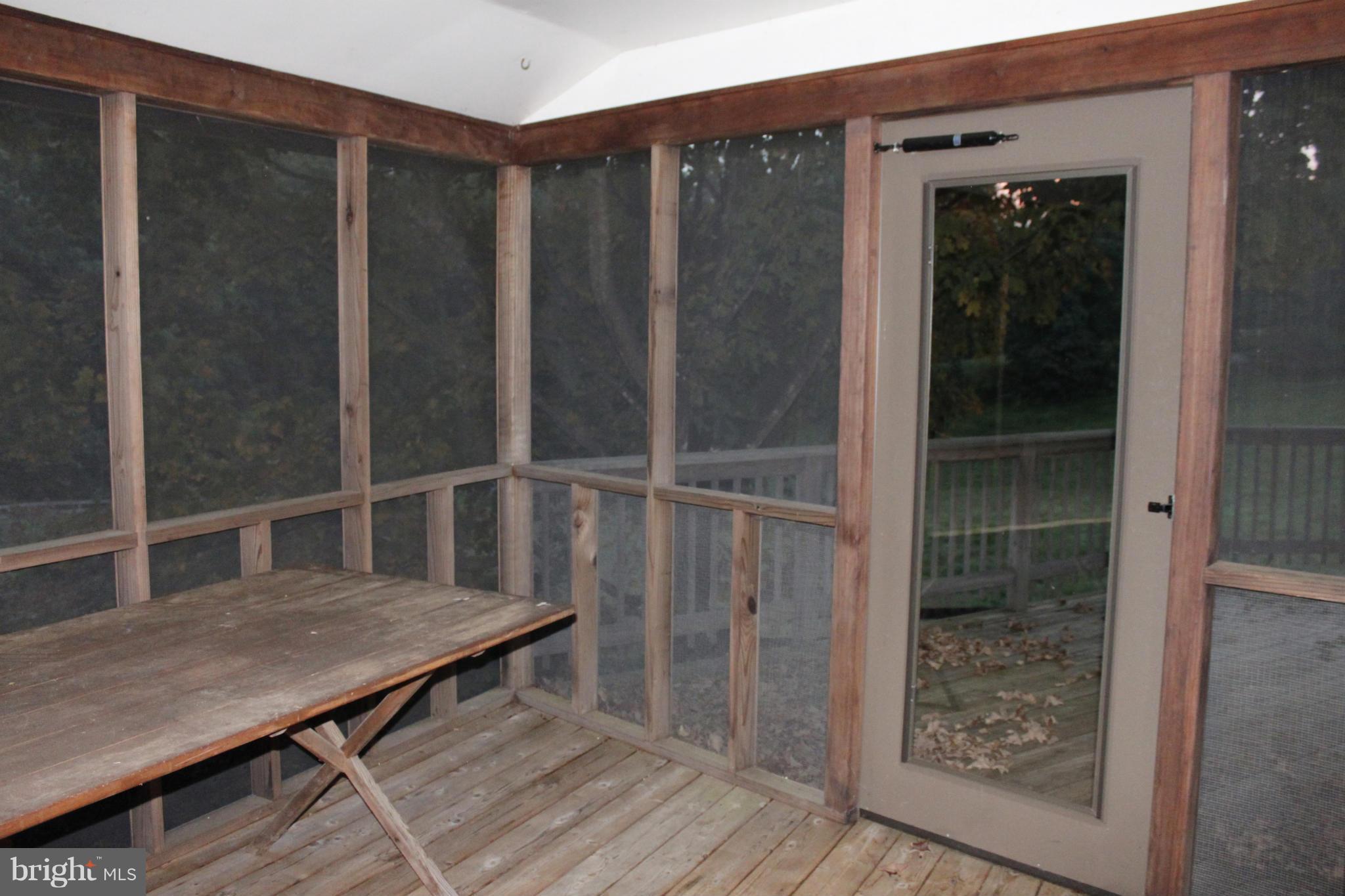 201 Hunters Road Washington, VA 22747 - Photo 23 of 30 Screened porch leads to wrap around deck.