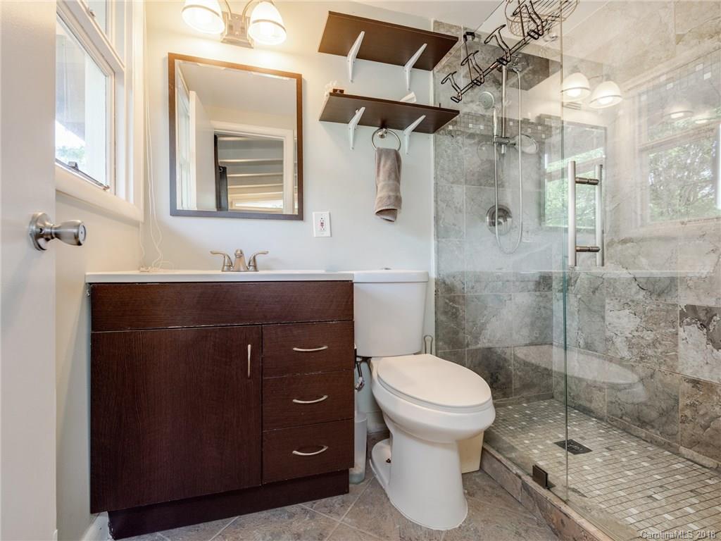 525 Scaleybark Road Charlotte, NC 28209 - Photo 19 of 24 a bathroom with a sink toilet and shower