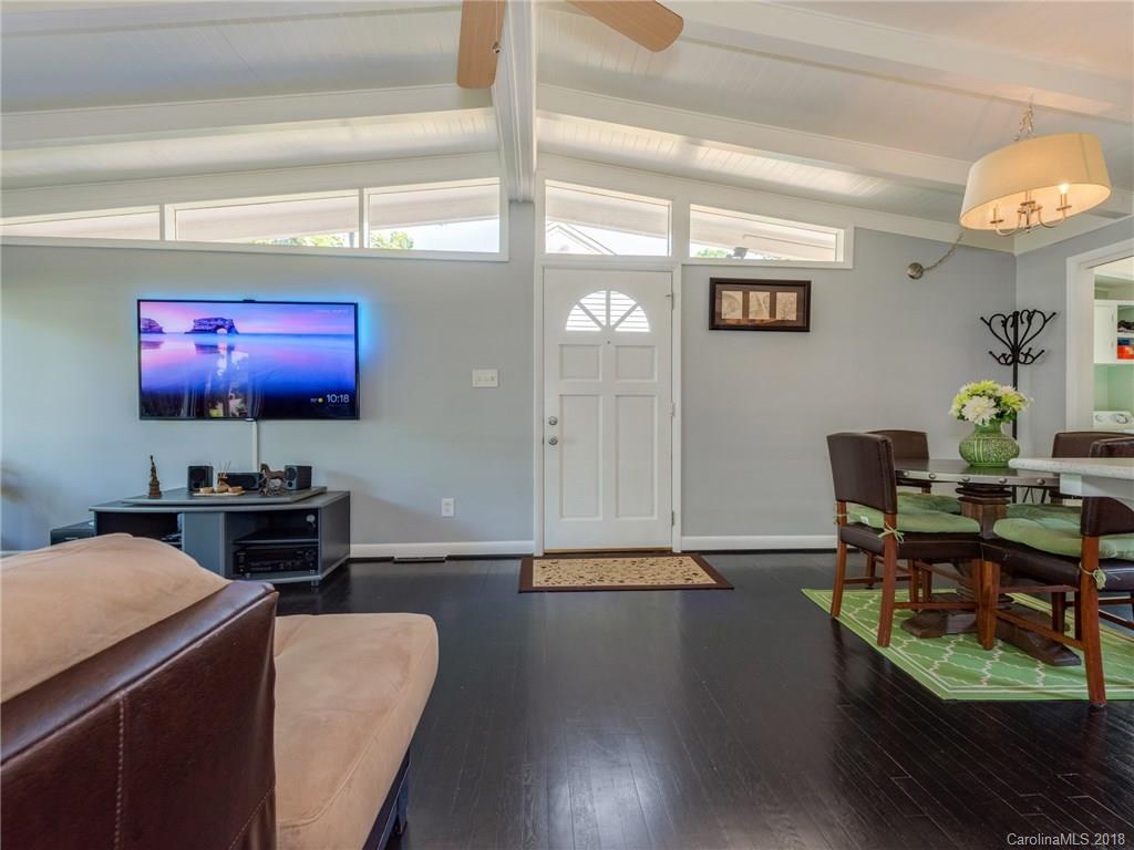 525 Scaleybark Road Charlotte, NC 28209 - Photo 5 of 24 a living room with furniture and a flat screen tv