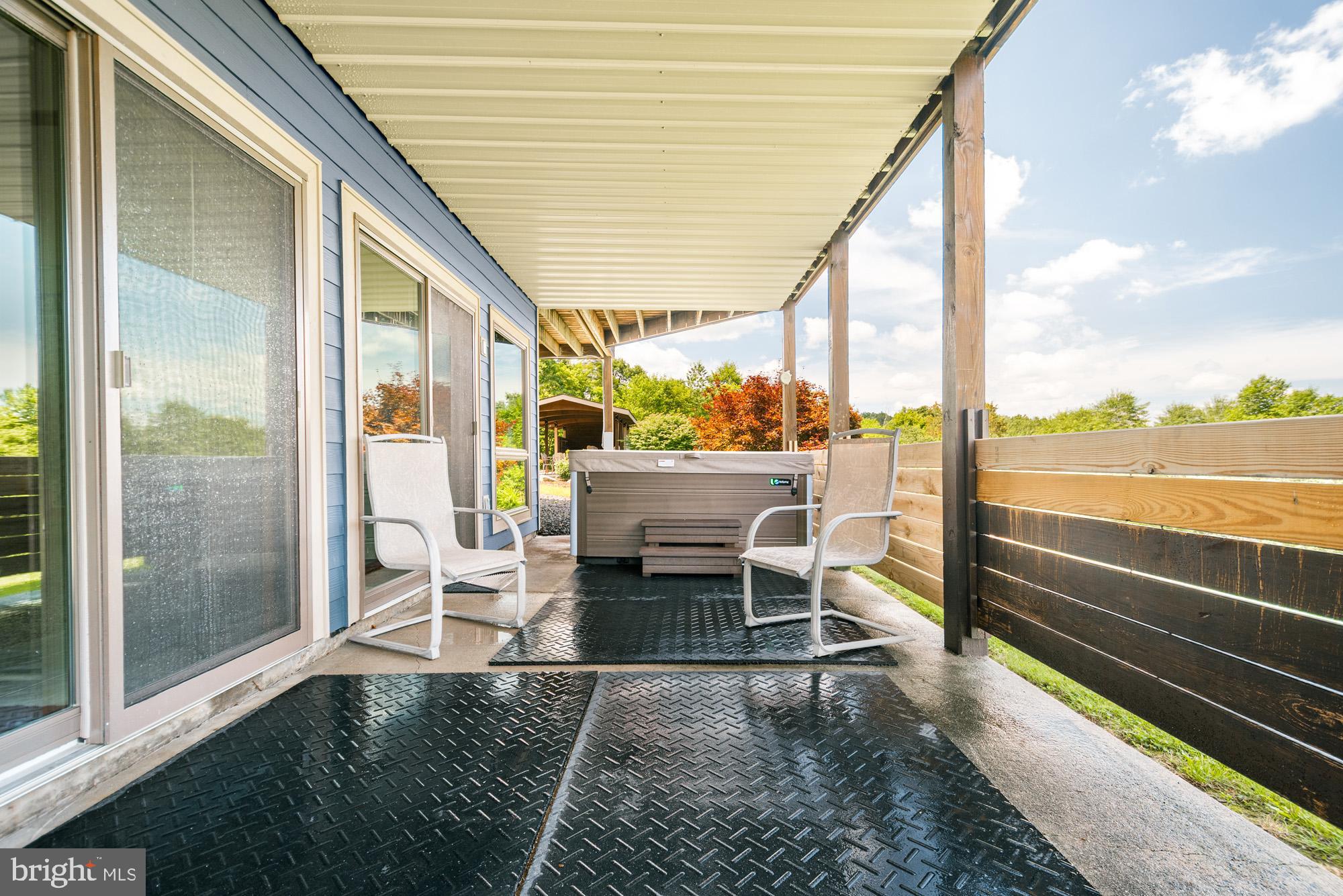 1875 Pysell Crosscut Road Oakland, MD 21550 - Photo 22 of 67 a building outdoor space with patio furniture and ocean view